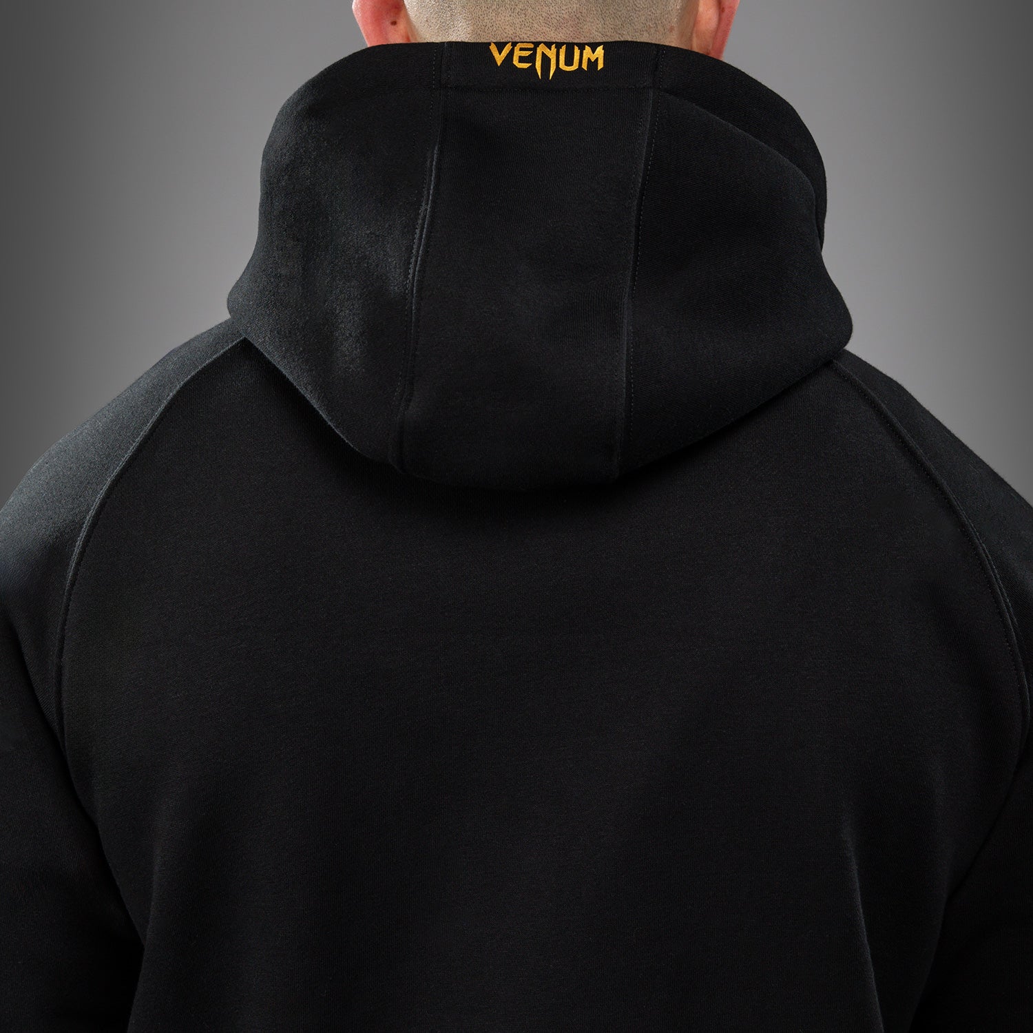 venum-ufc-zenith-replica-zip-hoodie-herren-champion-schwarz-gold image 6