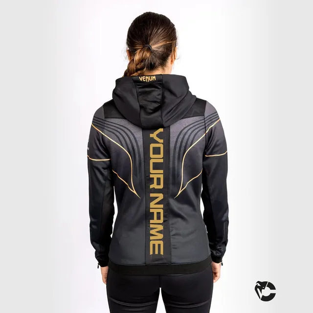 venum-ufc-authentic-fight-night-2-0-damen-walkout-hoodie-champion-schwarz-gold image 1