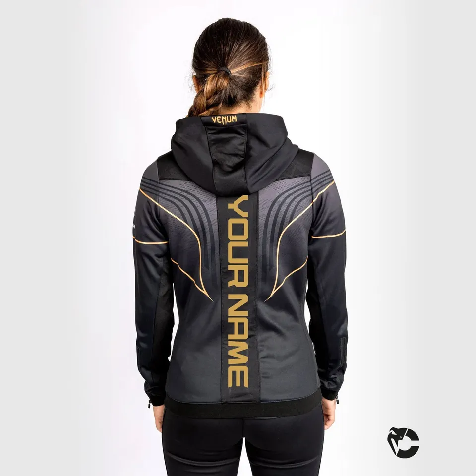 venum-ufc-authentic-fight-night-2-0-damen-walkout-hoodie-champion-schwarz-gold image 1