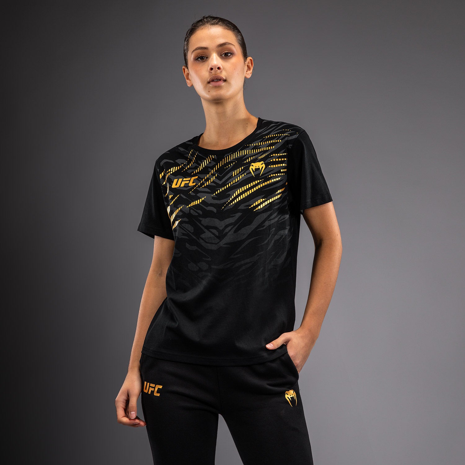 ufc-fusion-by-venum-replica-damen-t-shirt-kurzarm-champion-schwarz-gold image 1