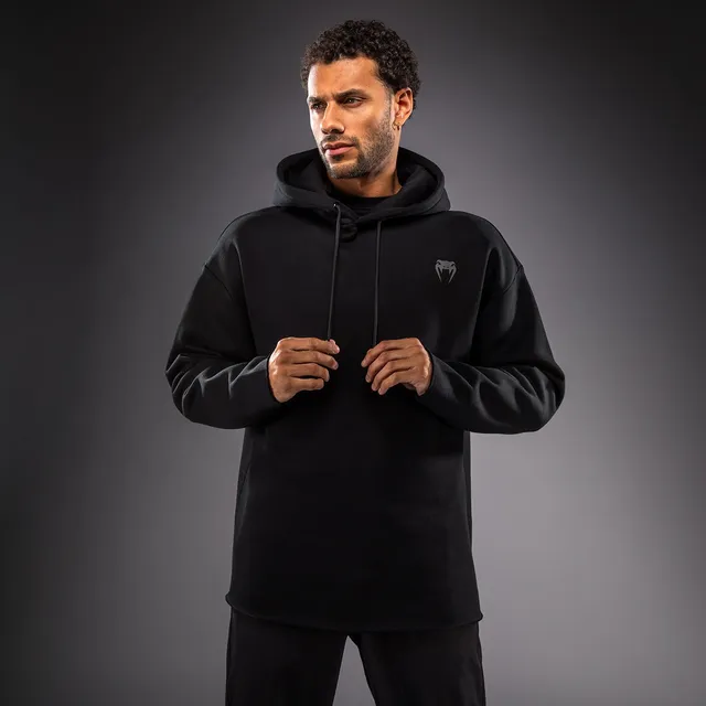 venum-divide-winter-kapuzenpullover-schwarz image 1