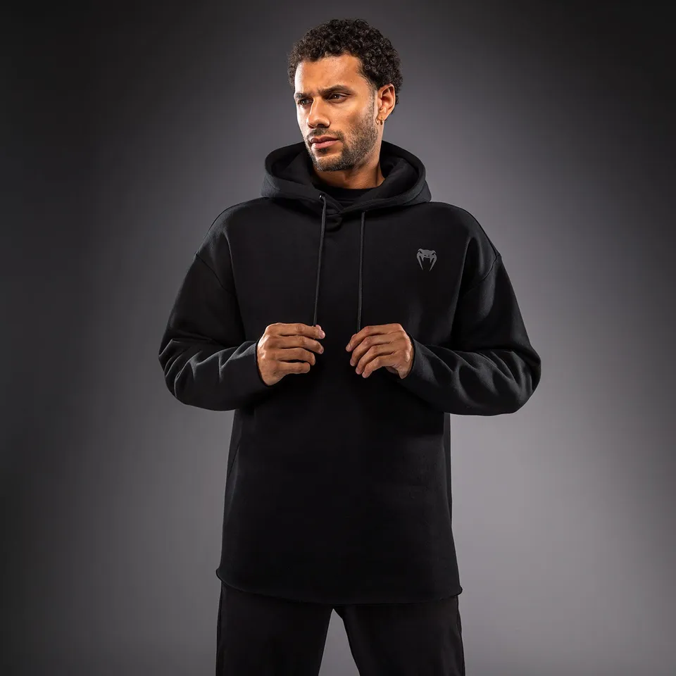 venum-divide-winter-kapuzenpullover-schwarz image 1