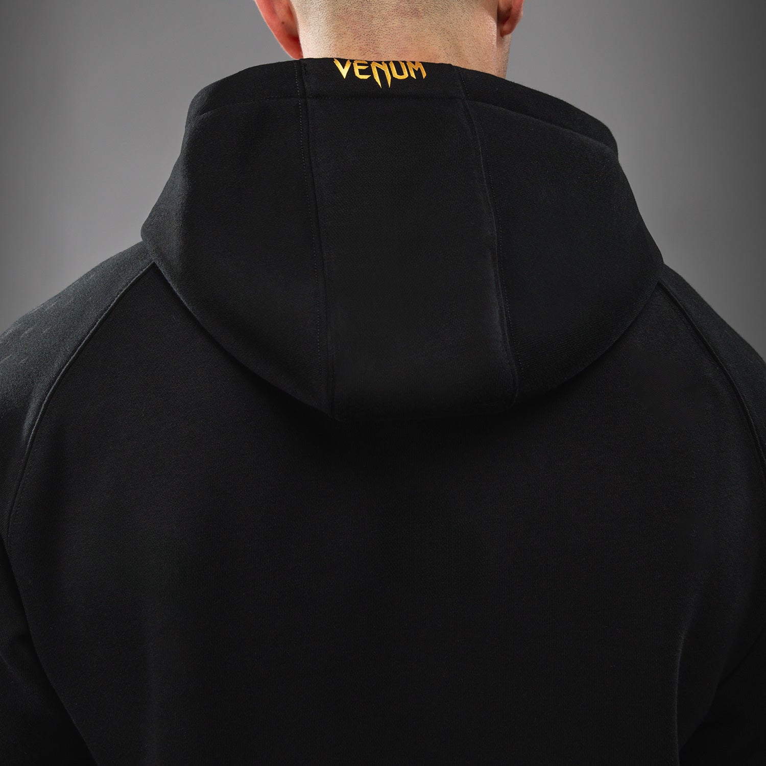 venum-ufc-zenith-by-venum-replica-pullover-hoodie-herren-champion-schwarz-gold image 5