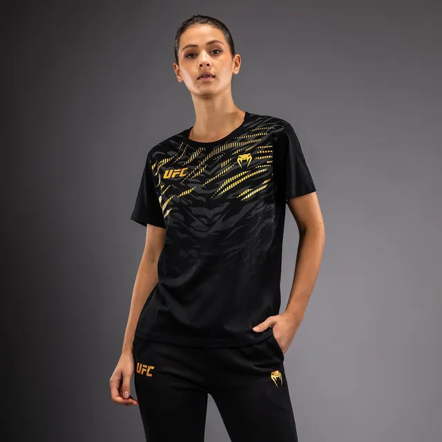 ufc-fusion-by-venum-replica-damen-t-shirt-kurzarm-champion-schwarz-gold image 1