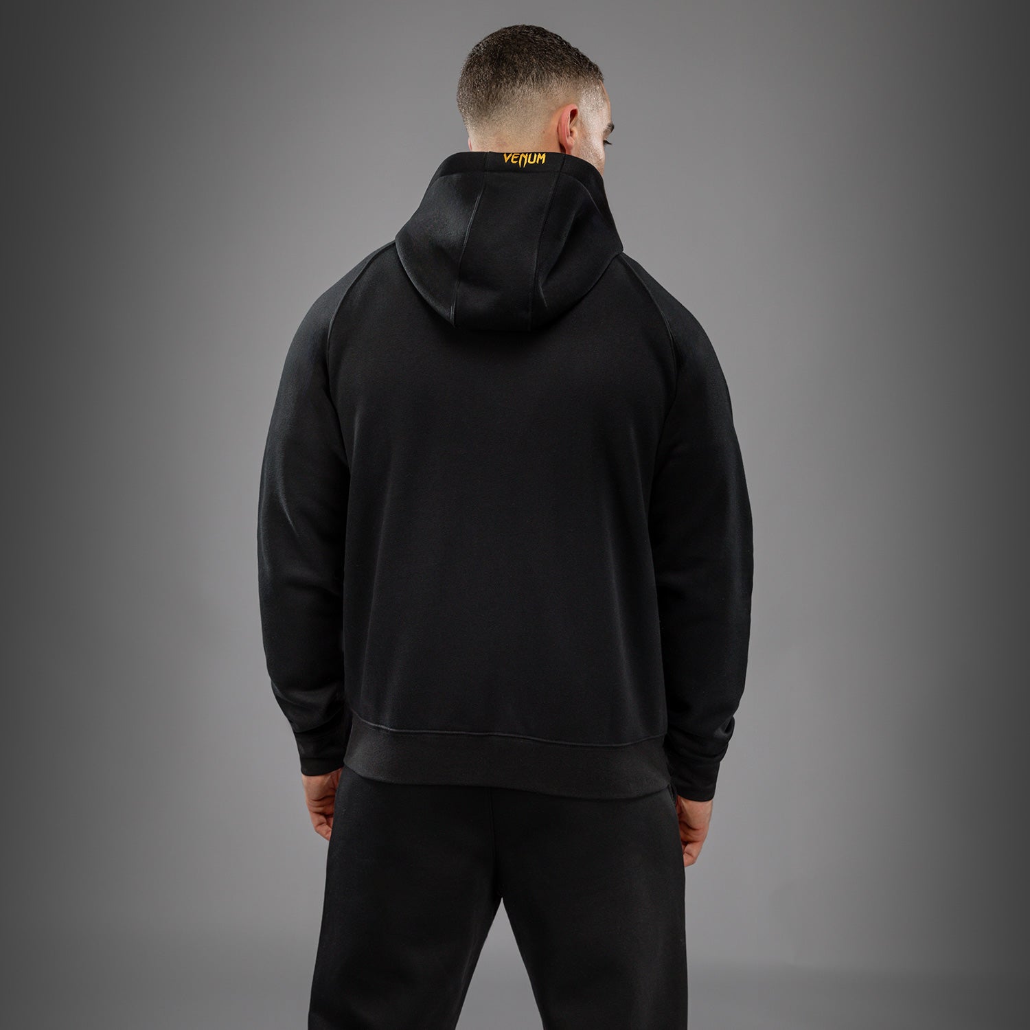venum-ufc-zenith-replica-zip-hoodie-herren-champion-schwarz-gold image 3