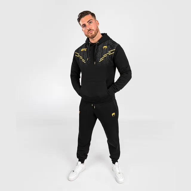 ufc-adrenaline-by-venum-replica-m-nner-pullover-hoodie-champion-schwarz-gold image 1