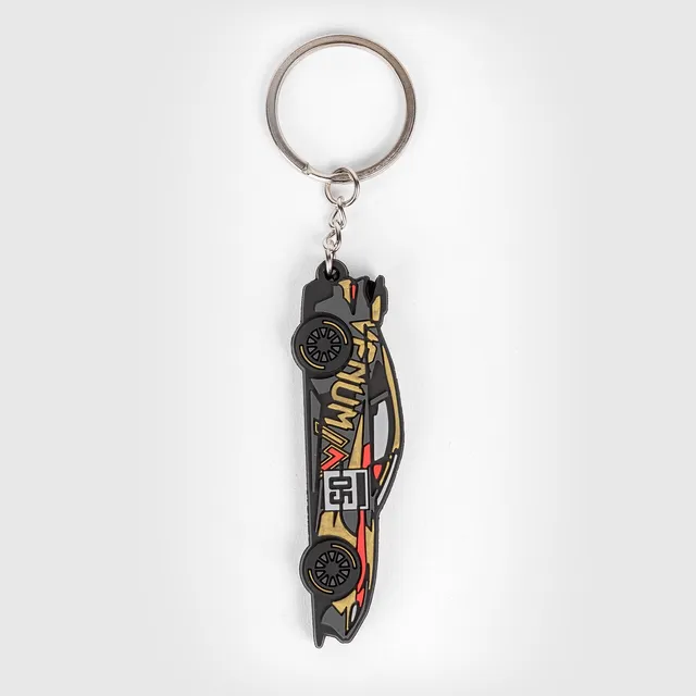 venum-x-mirage-aston-martin-vantage-gt4-schl-sselanh-nger-schwarz-gold-rot image 1