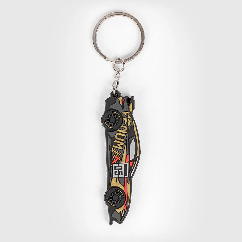 venum-x-mirage-aston-martin-vantage-gt4-schl-sselanh-nger-schwarz-gold-rot image 1