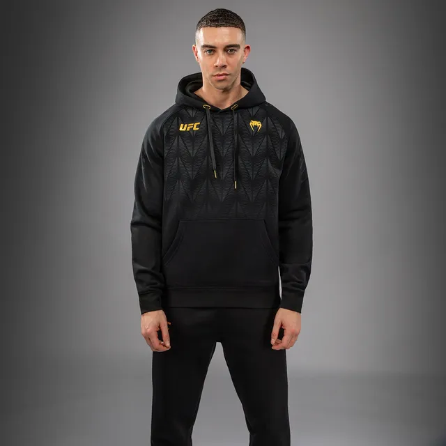 venum-ufc-zenith-by-venum-replica-pullover-hoodie-herren-champion-schwarz-gold image 1